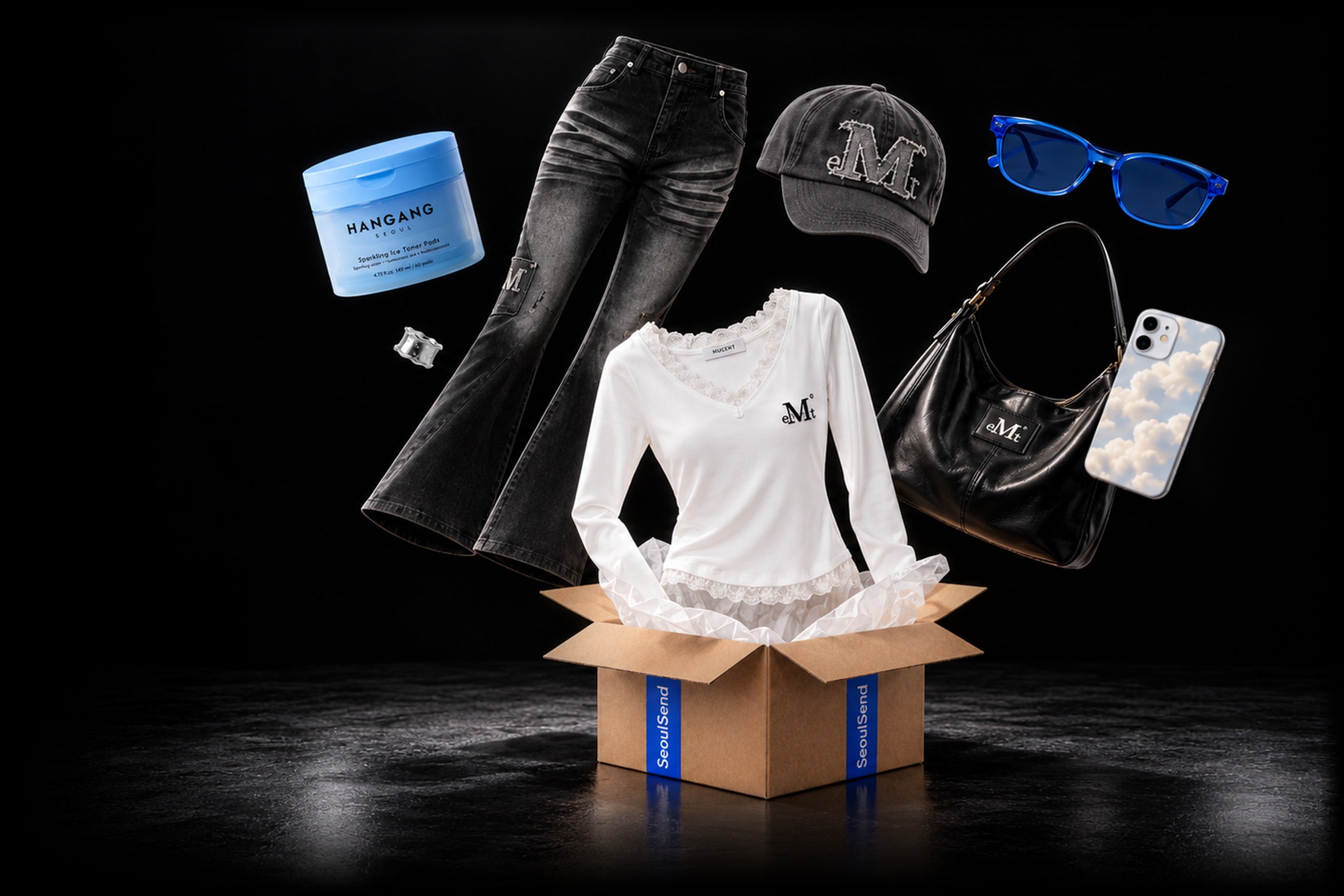 SeoulSend box with a white lace top, flared jeans, cap, sunglasses, bag, toner pads and phone case floating out